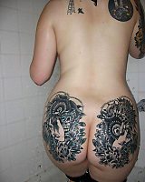 Tattooed Girl With Piercing Posing In Lingeri.