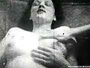 Vintage Video Of A Women Whose Naked Boobs Are Both Being Invaded