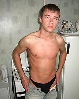 Younger guy removing his jeans undressed and stroking that big uncut cock until it