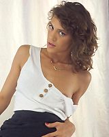 Curly Haired Brunette With Tiny Tits Spreads Her Legs