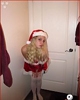Girl Teasing Shows Stockings Posing In Xmas Outfit Home.