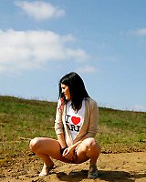 Brunette Wets The Sand Fucking Her Feet With Her Pee