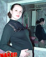 Dark Haired Pregnant Amateur In Stockings Posing