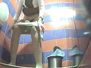 Two Clothed Babes Pissing In A Spycammed Public Toilet