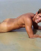 Uncut latin guy rolls around on the beach naked showing his hot ass toying at m