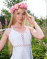 Watch As This Cute Blonde Teen Plays On The Flower Field And Gets Rid Of Her Sexy White Dres