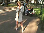 Swarthy Puss Opens Up Her Fur Coat Outdoors shot in the Park