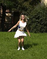 Blond Cheerleader Outdoor Spreads Legs Posing
