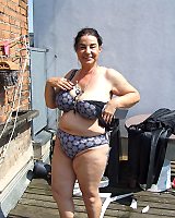 Dark Haired Grandma With Enormously Big Tits Posing Outdoor