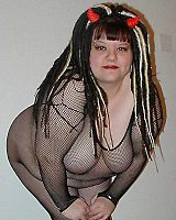 Alternative Fat devil girl in fishnet bodystocking