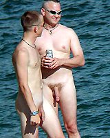 Nude Men Sunbathe On The Beach